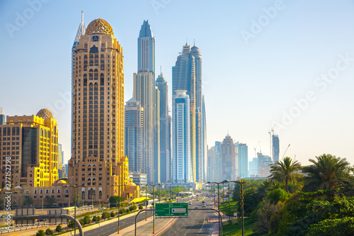 Dubai  UAE United Arabs Emirates.  Arjaan building and Dubai marina skyscrapers at the background. King Salman Al Saud highway view. Hotels and office buildings of UAE