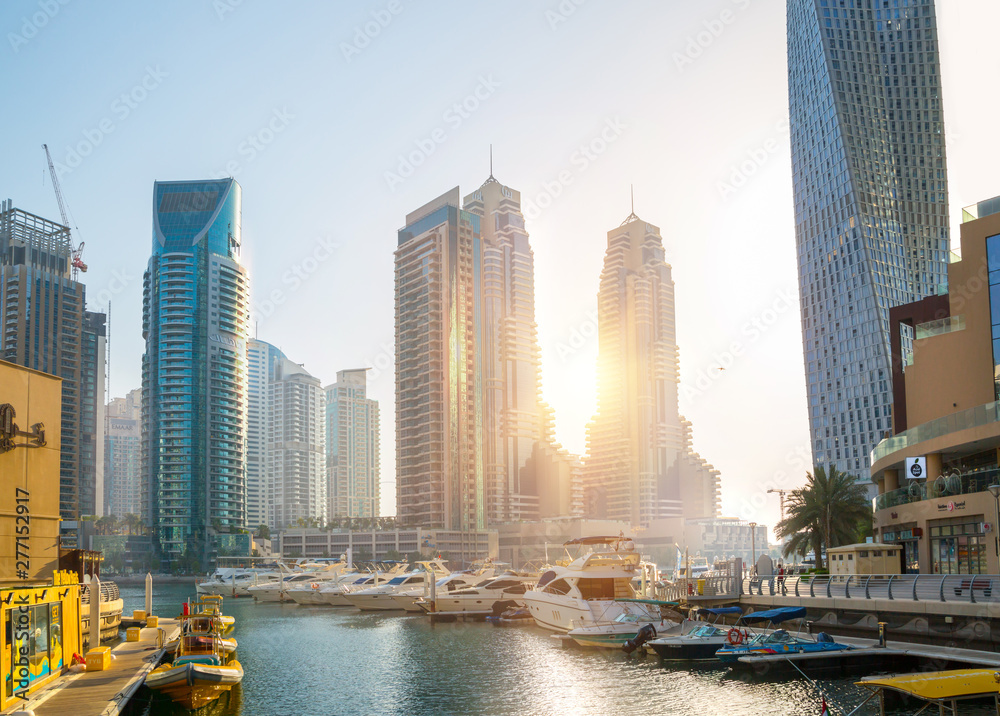Obraz premium Dubai marina skyscrapers at sunset. Amaar walk with lots of cafes, restaurants and hotels