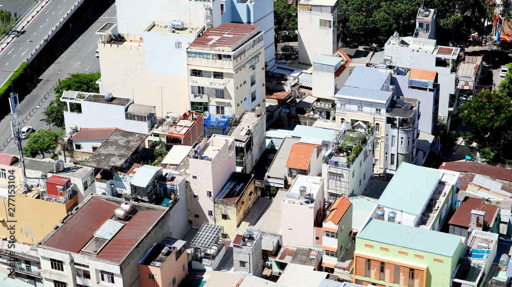 Fototapeta premium Close up the City Buildings and Roads from Aerial View, Saigon