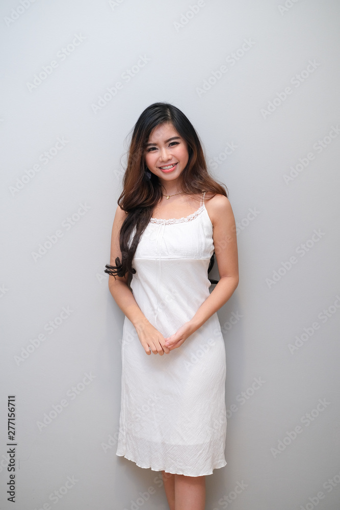 Asian girl with nice outfit, wearing a sleeveless dress. Asian girl with nice outfit, wearing a sleeveless dress.