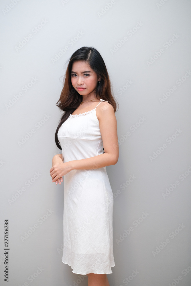 Asian girl with nice outfit, wearing a sleeveless dress. Asian girl with nice outfit, wearing a sleeveless dress.