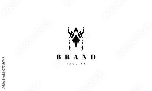 Vector logo on which is an abstract image of a shaman mask.