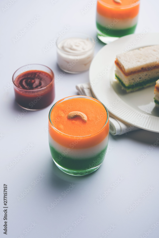 Tiranga / Tricolour sweet food made using indian flag colours and served in a glass in layers. selective focus Tiranga / Tricolour sweet food made using indian flag colours and served in a glass in layers. selective focus
