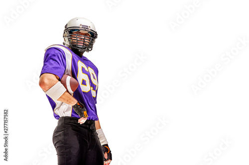 American football player in uniform poses for the camera. Handsome athlete in uniform isolated white background. Copy space, white background, isolate. Concept sport, challenge, and you are ready.