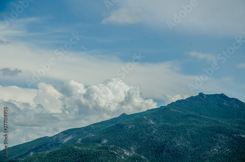 beautiful landscape of mountains and cumulus clouds summer vacation vacation trip