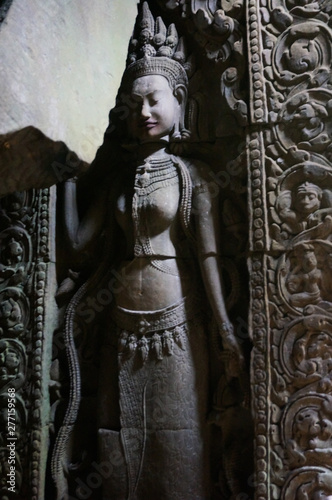 Sculptured wall at Angkor Wat. An Apsara or angel with nice hair style © yaangsgap