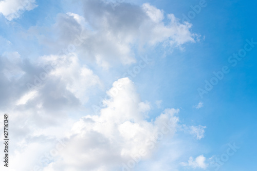 Light blue sky with clouds natural light background © Andrii