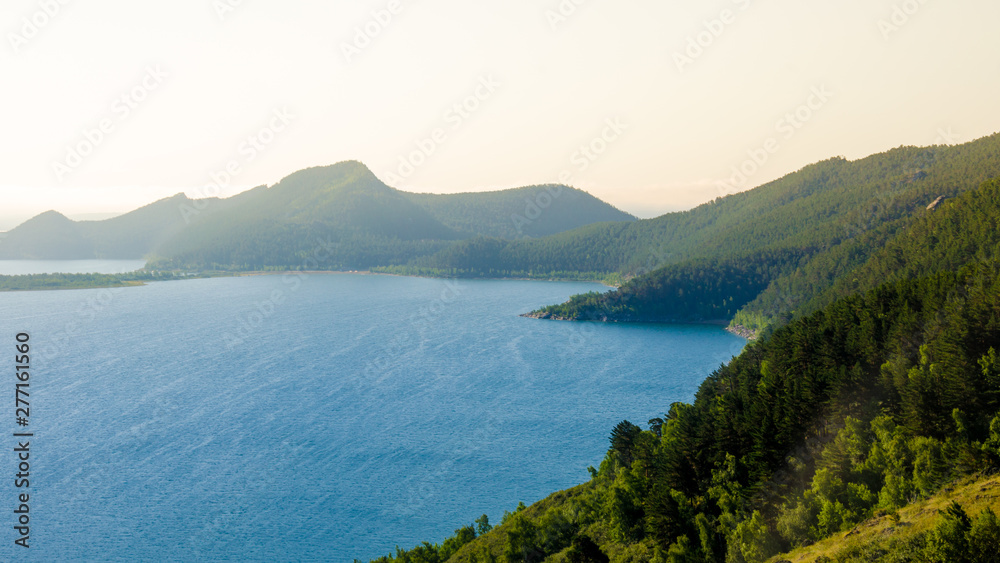 Mountain Lake landscape hills pine forest and clouds summer rest tourism