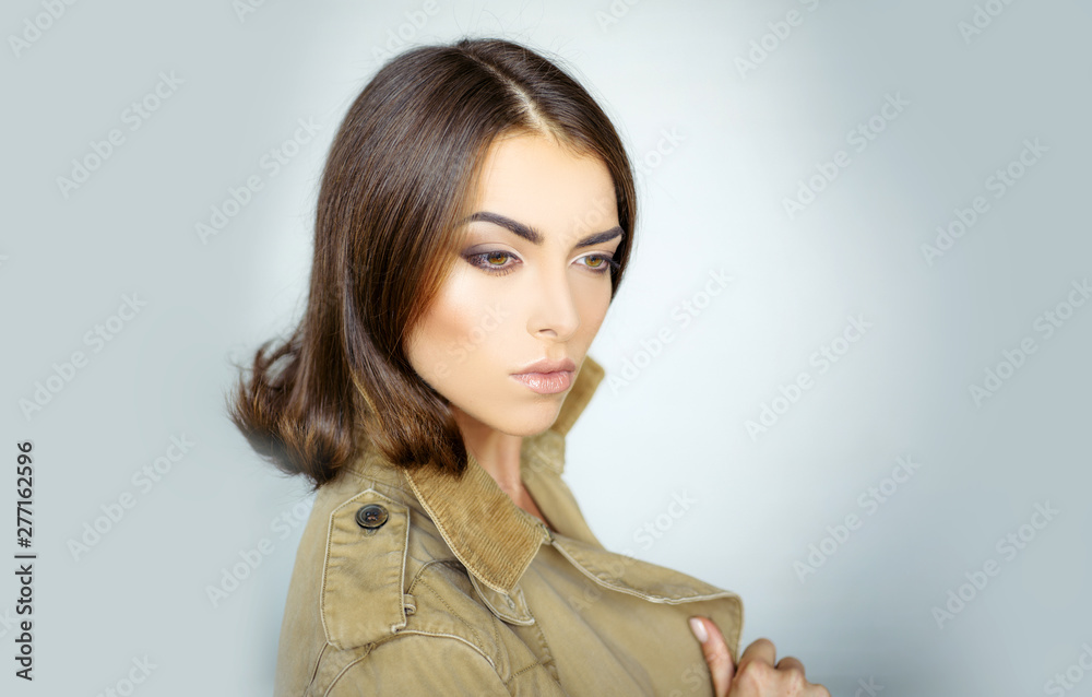 Lovely sexy brunette girl. Beauty woman in studio on gray background. Close-up portrait. Hairstyle styling.Makeup, smooth skin. Advertisement, magazine. Attractive girl with perfect skin. Lovely sexy brunette girl. Beauty woman in studio on gray background. Close-up portrait. Hairstyle styling.Makeup, smooth skin. Advertisement, magazine. Attractive girl with perfect skin.