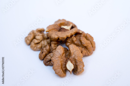 Close-up of walnut kernels on white background