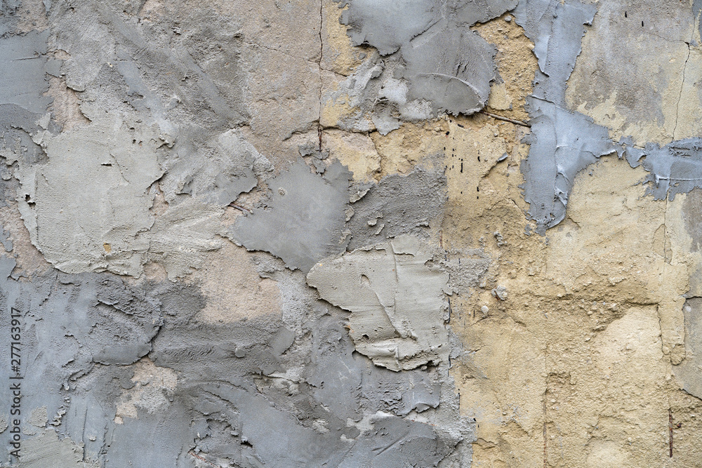 Fototapeta premium texture uneven plaster. Gray stucco background with careless pieces. Manual plaster wall uneven. Patches on plaster
