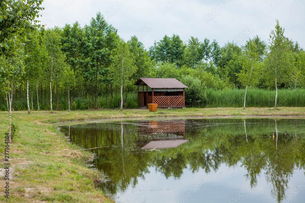 Holiday house near the lake. The concept of fishing and recreation