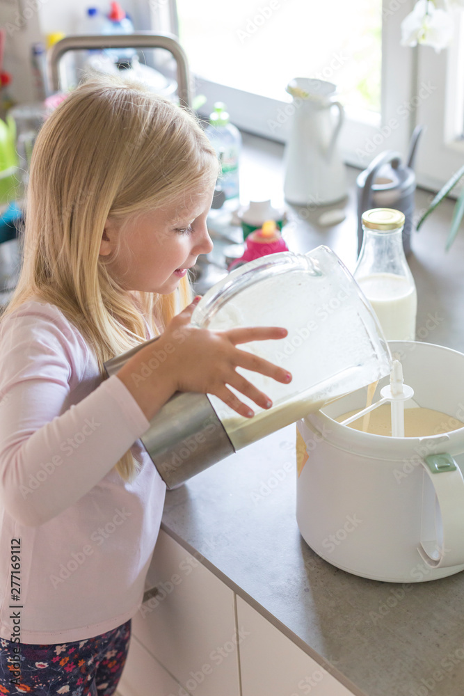 Portrait of young blonde girl making ice cream Portrait of young blonde girl making ice cream