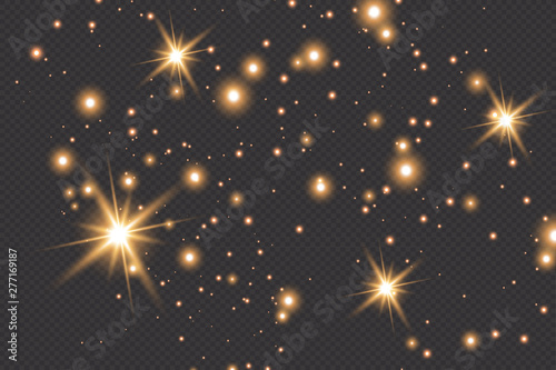 Set of gold glowing light effects isolated on dark background. Glow light effect. Star exploded sparkles.
