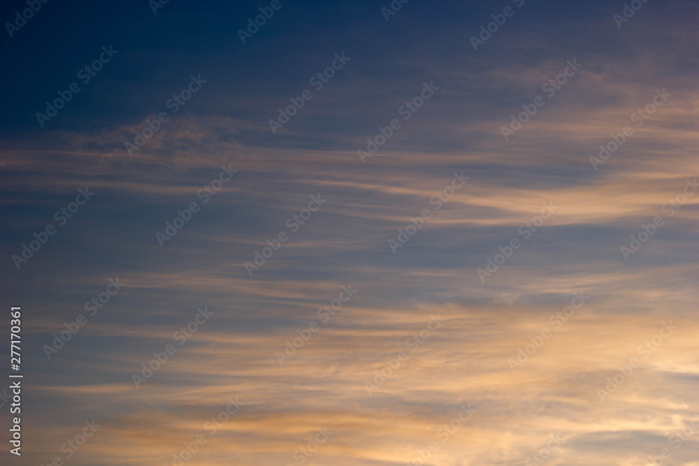 The sky at sunset with orange clouds. Background, texture