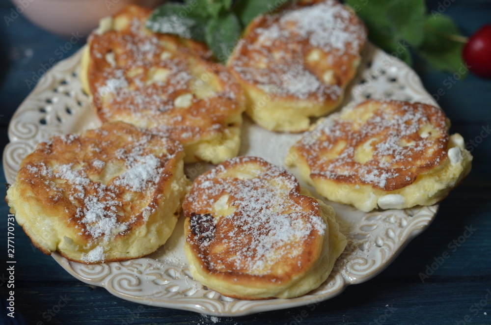 Fried pancakes with powdered sugar Fried pancakes with powdered sugar