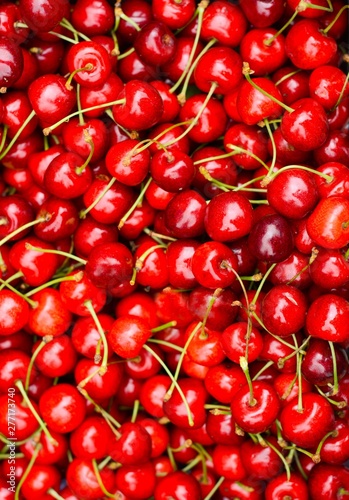 Red ripe sweet cherries in a box