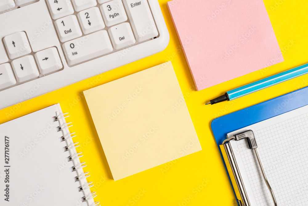 Colored empty papers with copy space on the yellow background table with pc keyboard. Colored empty papers with copy space on the yellow background table with pc keyboard.