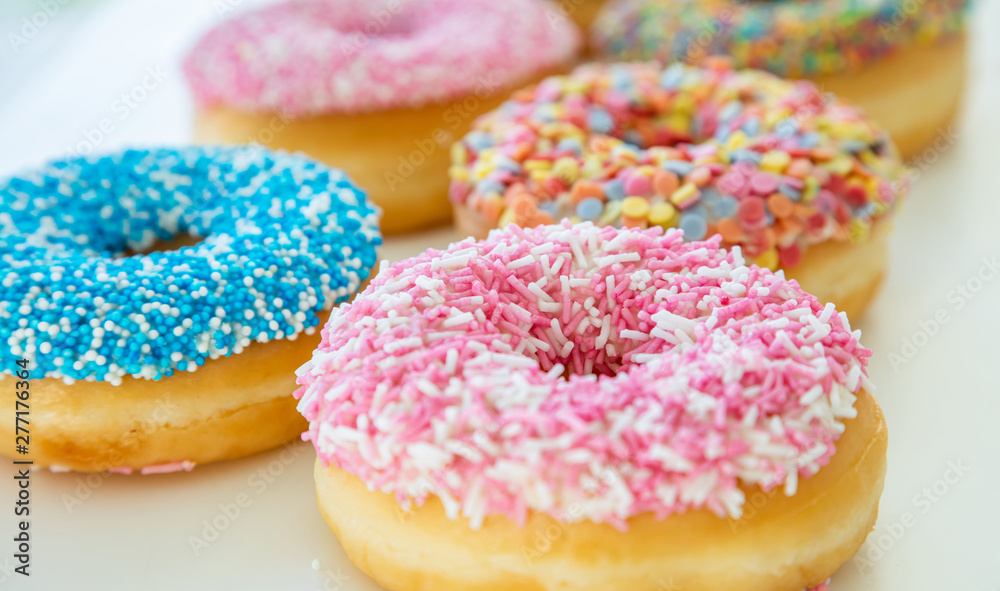 Doughnuts assorted on white. Close up view