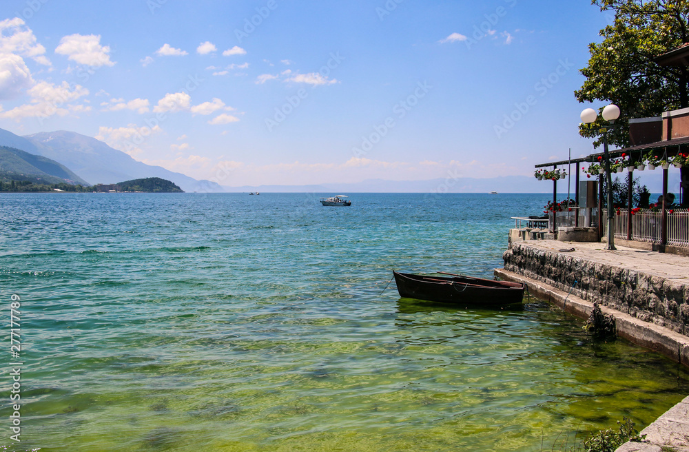 Φωτογραφία Beautiful view of Ohrid Lake with a fishing boat, Republic of North Macedonia