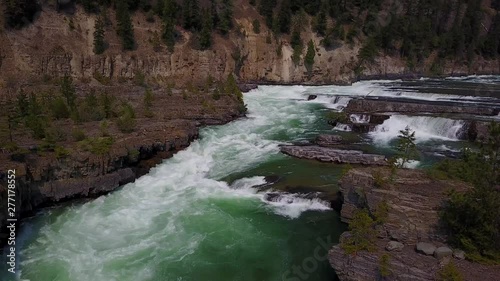 the water falls, aerial drone footage, downward view going upward, Kootenai falls, Montana. v02 photo