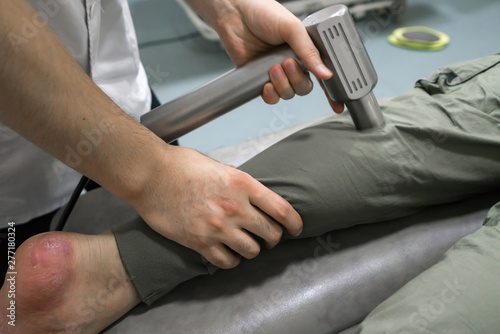 The doctor is rehabilitating the patient's legs
