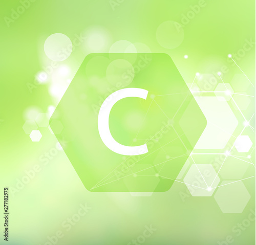 Vitamin C. Abstract green background.