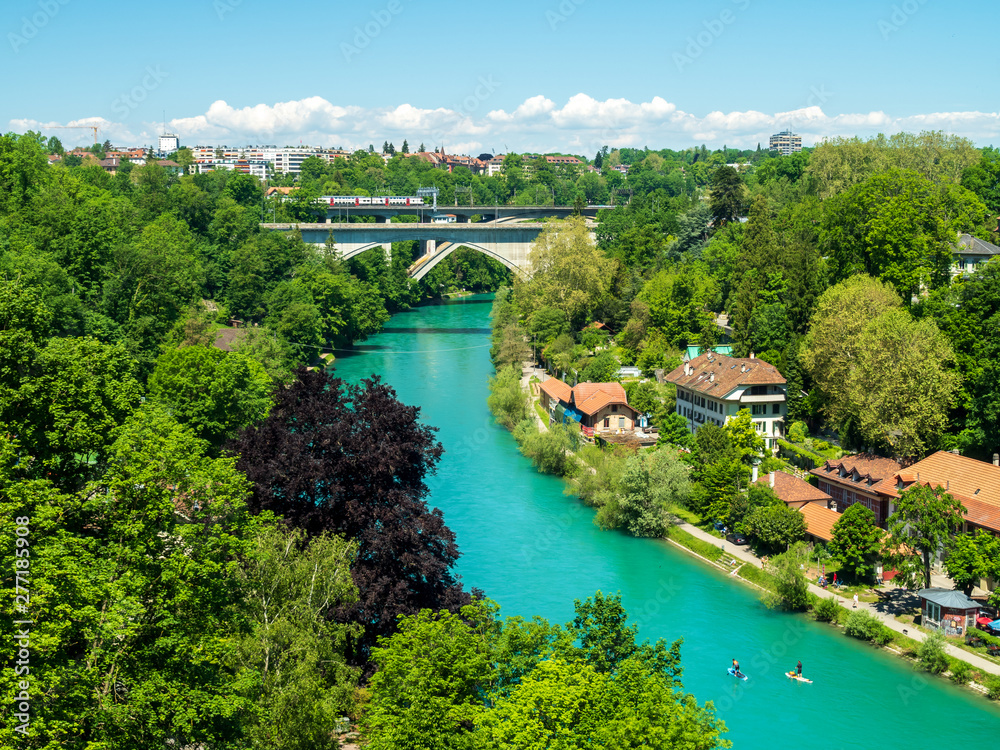 Bern, Switzerland - Jun 1st 2019: .The Aare river flows around three sides of the city of Bern. With its crystal-clear turquoise water Bern, Switzerland - Jun 1st 2019: .The Aare river flows around three sides of the city of Bern. With its crystal-clear turquoise water