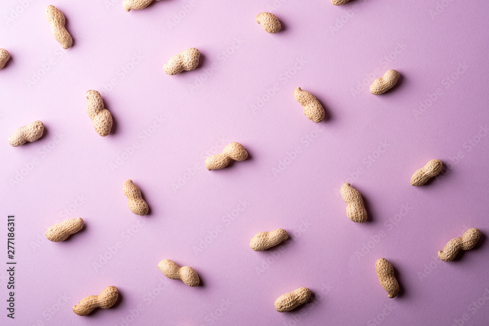 Peanut minimal pattern on purple background backdrop food nut texture