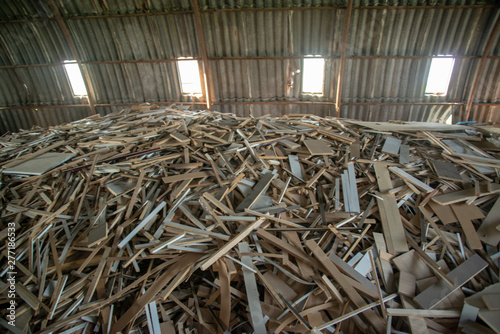 Taking photographs of wood plywood, used for making pellets
