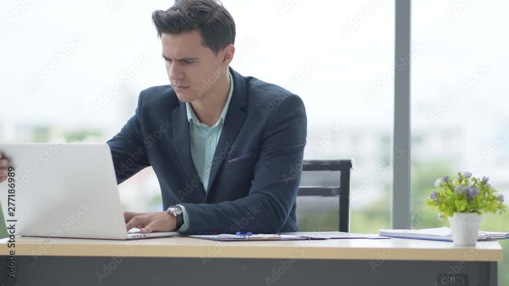 Male businessmen are working on computers at the office. Male businessmen are working on computers at the office.