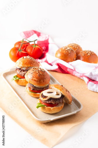 Food concept Homemade beefs hamburgers serve on square plate on white background with copy space