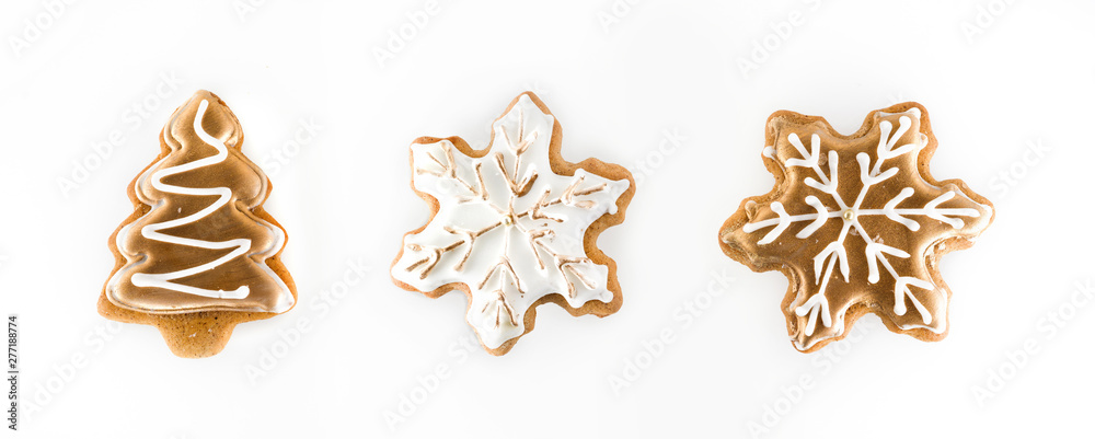 Christmas gingerbread isolated on white background. Set ginger biscuit cookies in shape of golden fir Christmas tree and white snowflake. Christmas gingerbread isolated on white background. Set ginger biscuit cookies in shape of golden fir Christmas tree and white snowflake.