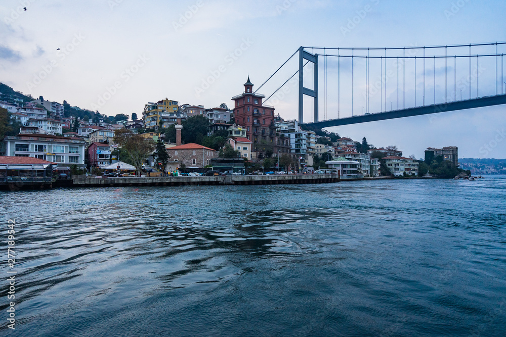 Istanbul cityscape from a ferry boat sailing the Bosphorus strait towards Fatih Sultan Mehmet Bridge (Second Bosphorus Bridge), Istanbul, Turkey Istanbul cityscape from a ferry boat sailing the Bosphorus strait towards Fatih Sultan Mehmet Bridge (Second Bosphorus Bridge), Istanbul, Turkey