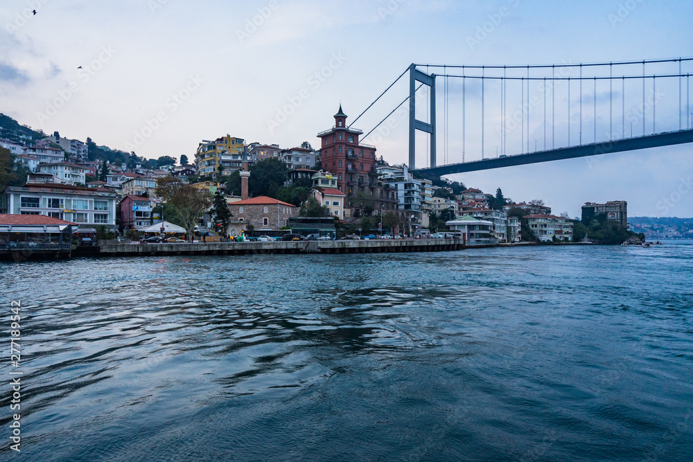 Istanbul cityscape from a ferry boat sailing the Bosphorus strait towards Fatih Sultan Mehmet Bridge (Second Bosphorus Bridge), Istanbul, Turkey