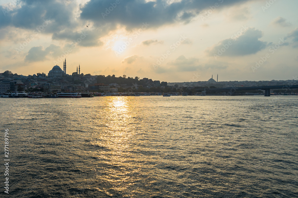 Istanbul skyline at sunset dominated by Suleymaniye Mosque, the second largest mosque in Istanbul, built in 1550.