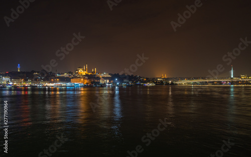 Istanbul night panorama viewed form Galata Bridge with the illuminated Suleymaniye Mosque, Turkey