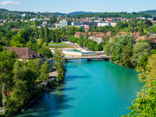 Bern, Switzerland - Jun 1st 2019: .The Aare river flows around three sides of the city of Bern. With its crystal-clear turquoise water