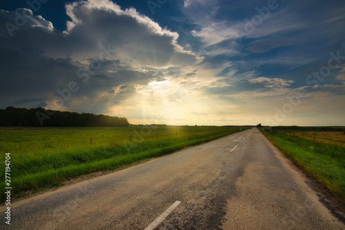 Storm clouds over the country road