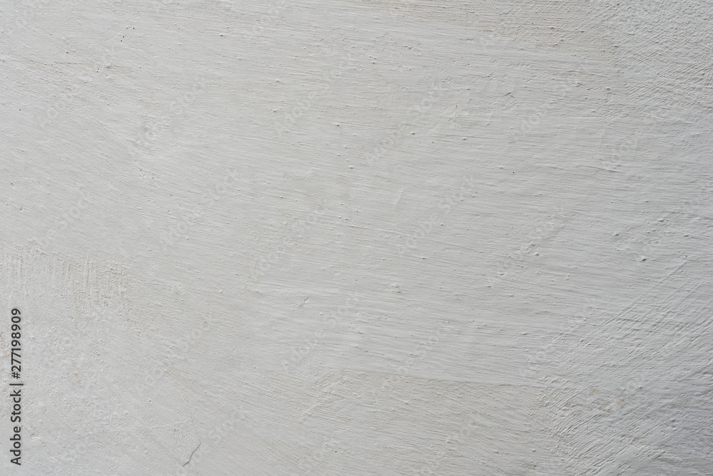 Texture of a concrete wall with cracks and scratches which can be used as a background Texture of a concrete wall with cracks and scratches which can be used as a background