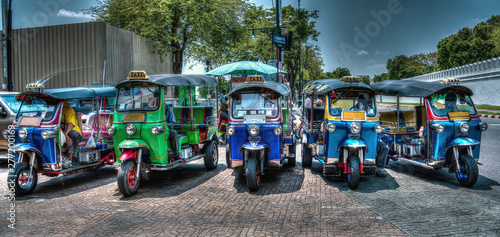 Photography HDR image of Tuk Tuk Rickshaw taxi lined up at Bangkok