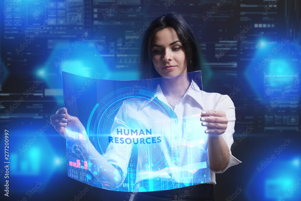 The concept of business, technology, the Internet and the network. A young entrepreneur working on a virtual screen of the future and sees the inscription: Human resources The concept of business, technology, the Internet and the network. A young entrepreneur working on a virtual screen of the future and sees the inscription: Human resources