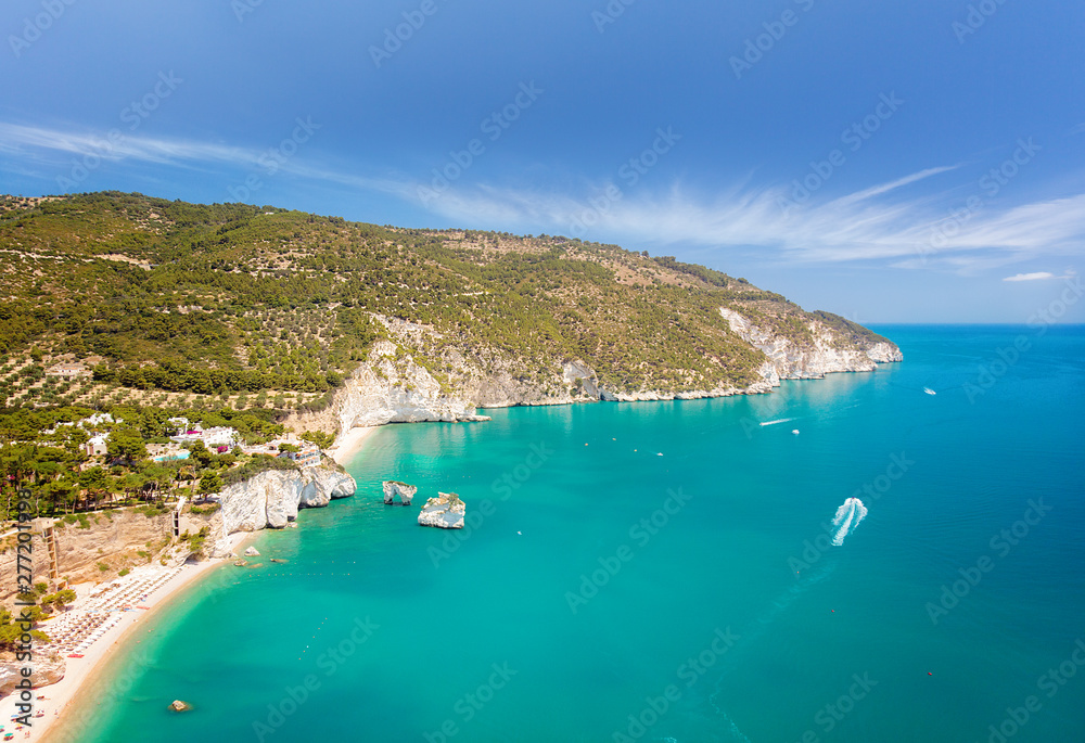 Aerial view of popular scenic touristic spot in Puglia, Italy - Faraglioni di Puglia, Baia delle Zagare, Apulia region. Captivating turquoise seascape of Adriatic sea