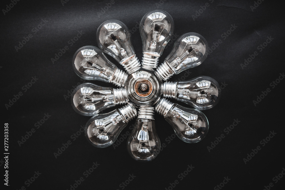 Idea concept with row of light bulbs and glowing bulb on background. Idea concept with row of light bulbs and glowing bulb on background.