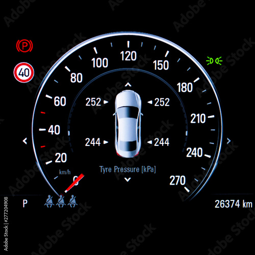 Close up of TPMS (Tyre Pressure Monitoring System) monitoring display on car dashboard panel. The pressure measurement given in kilopascal (kPa).Digital screen shows right correct tire pressure.