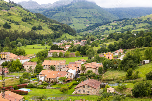 Landscape of a village in Valles Pasiegos, Cantabria, Spain photo