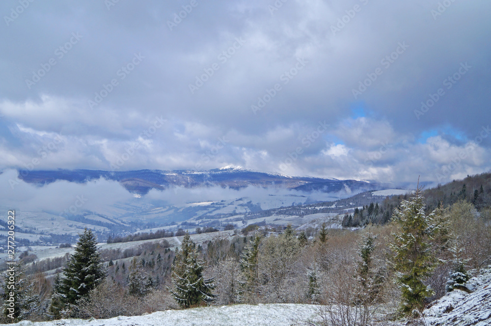 View of the Carpathian mountains covered with snow in a winter sunny frosty day
