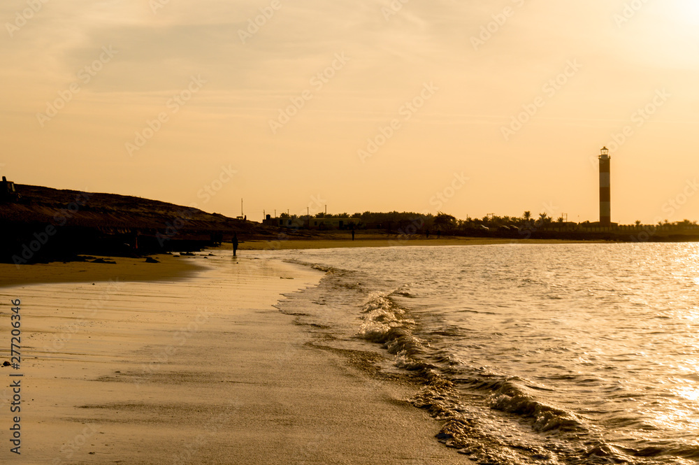 golden shot of shivrajpur beach in somnath gujarat india at dusk