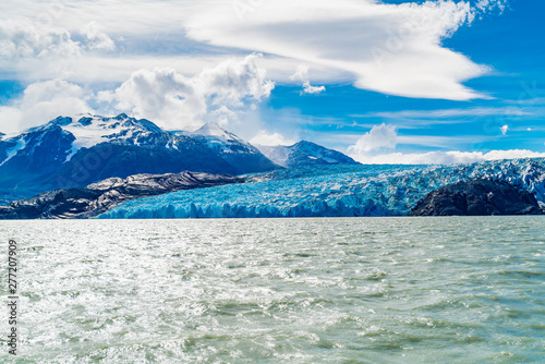 View of the majestic blue ice of Glacier Grey on the water of Lake Grey in Torres del Paine National Park