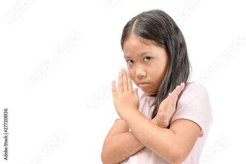 Serious cute girl showing crossed hands or forbidding gesture